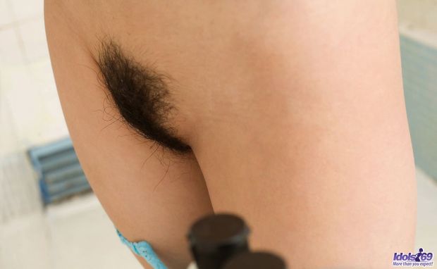 Haruka Sanada shows off her unshaved cunt.