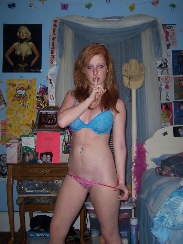 Young redhead takes selfie