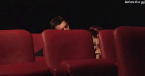 Couple having fun at cinema...