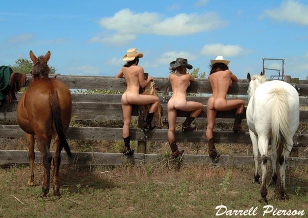 Three cowgirls on the fence hats bad boots only