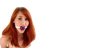 redhad girl with ballgag