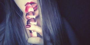 Red lips and a pink toy..