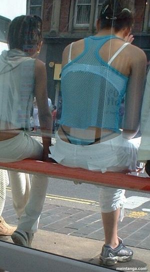 Black and blue thong at bus stop