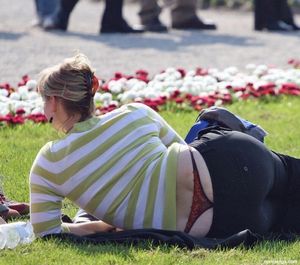 Red lace thong in park