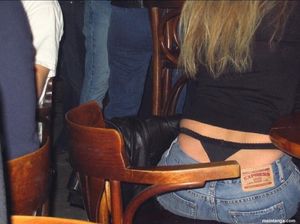Black thong sitting high on her waist