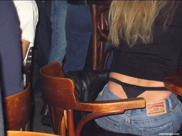 Black thong sitting high on her waist