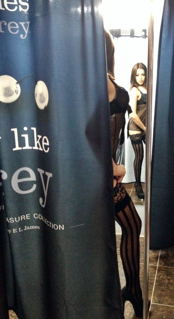 That girl purposely had left a gap in a changing-room curtain. All customers in the shop was able to saw how she put on that lingerie on her