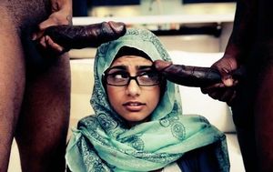 Mia khalifa posing with 2 big cocks