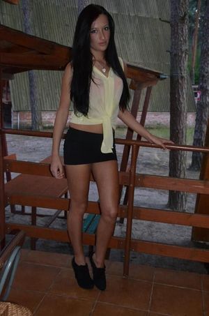 Dark hair chick in a slutty outfit