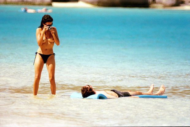 Penelope Cruz topless on a beach