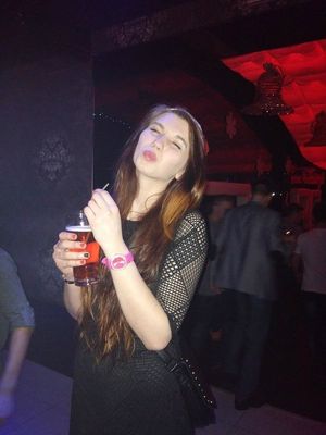 Hot chick preparing her mood with some drinks for restroom fun