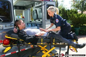 Stunning ambulance nurse gives a special treatment to her well-hung patient girl pic