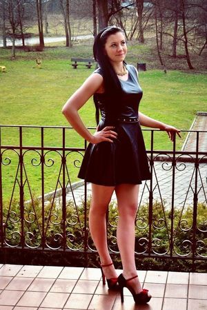 Chick in leather minidress