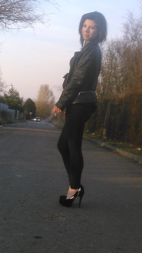 Brunette hitchhiker in leather jacket