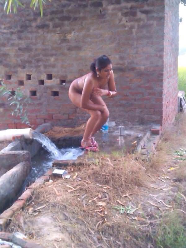 Indian bhabhi bathing in open