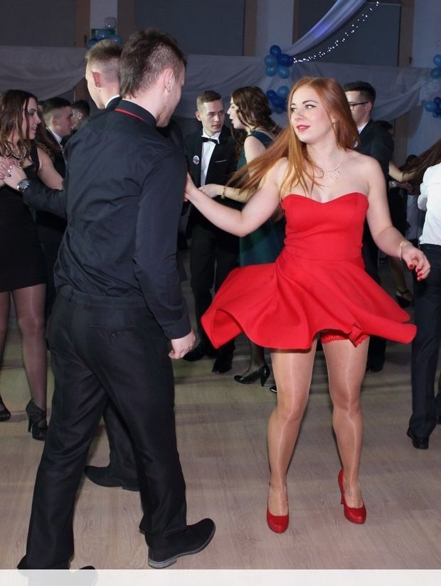 Young chick dancing in red dress