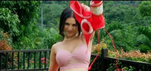 Sunny Leone striping her bra in public