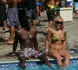 Hot mature wife in bikini flirts with young black studs at the pool