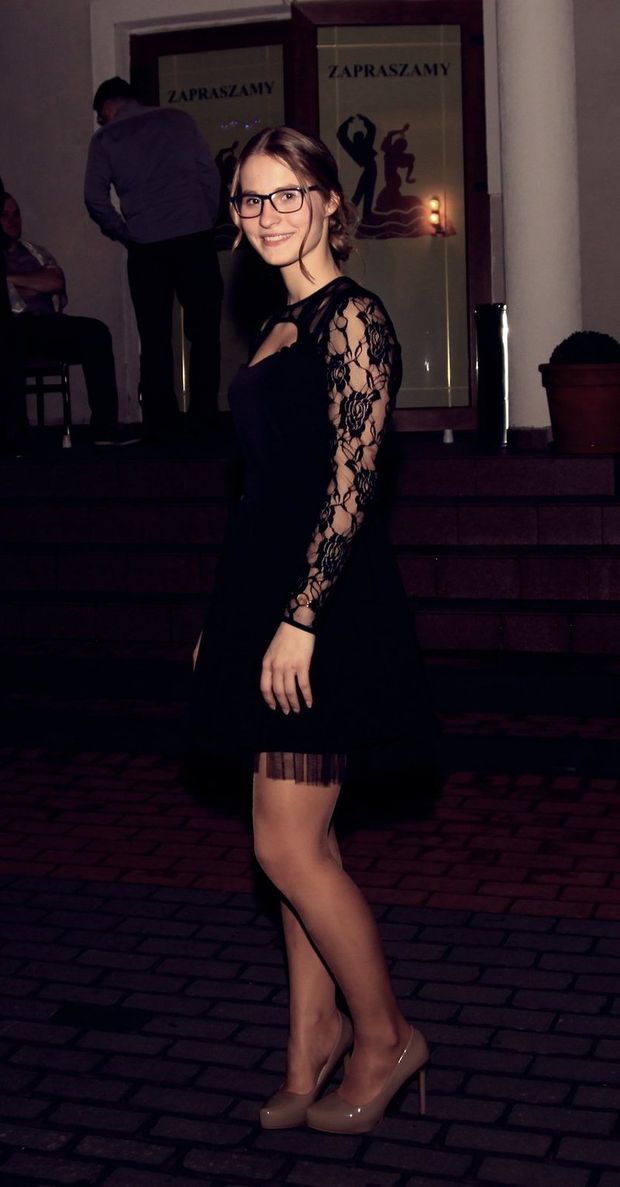 Cute rookie in black laced seethrough dress and heels