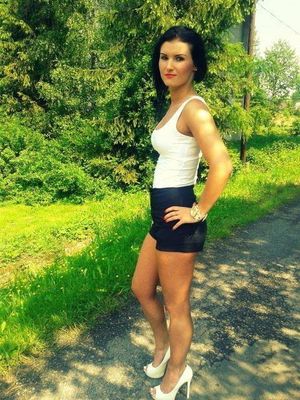 Leggy brunette on the roadside