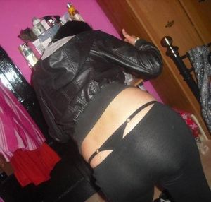 From her yoga pants, an exposed thong emerges