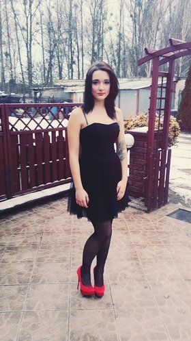 Young sweet rookie in tight dress and red heels