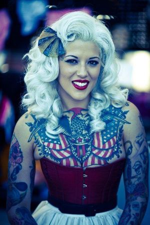American tattoo flags on boobs of this retro babe with amazing smile