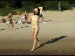 This teen nudist strips bare at a public beach