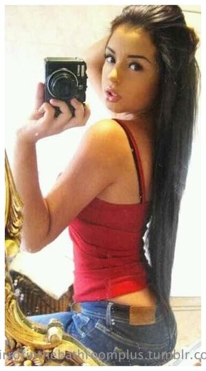 Gorgeous Brunette Girl in Red Shirt & Jeans Selfie