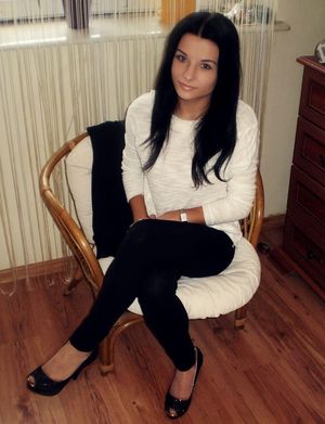 Brunette chick in black leggings, peeptoe heels and white blouse