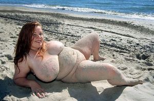 bbw redhead posing at the beach