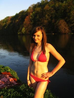Riverside chick in red bikini