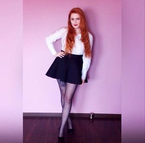 Nasty redhead posing in new outfit