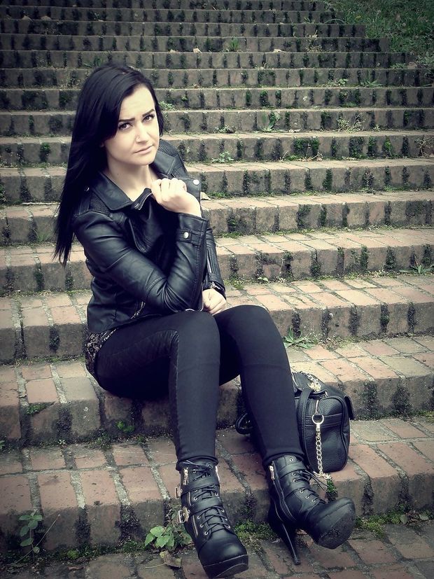 Leather chick on a stairs