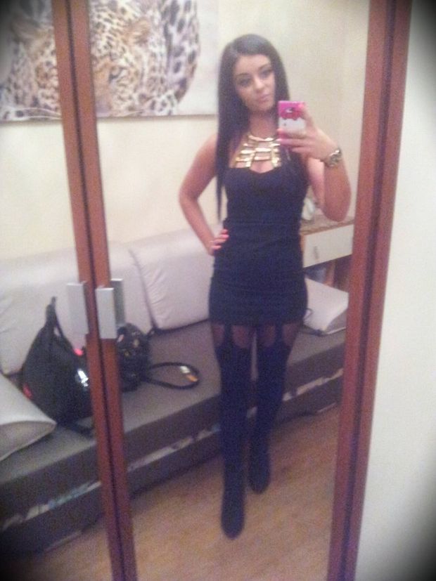 Nasty bimbo in slutty outfit making selfie before going out with her girls