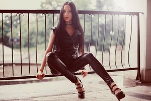 In latex leggings and high heels