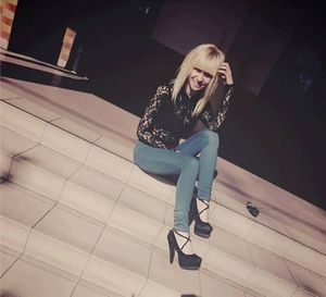 Hot blond in lace seethrough blouse and jeans