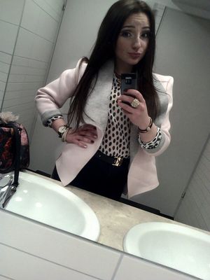 Sweet selfie after bitter swallow, but cash in her purse always make it easy.