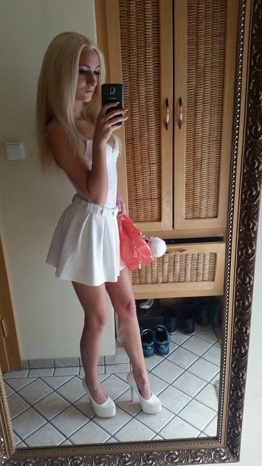 Blonde bimbo in cute white dress and high heels