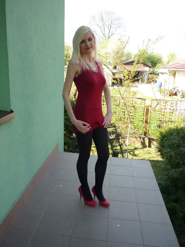Blonde bimbo in tight short red dress