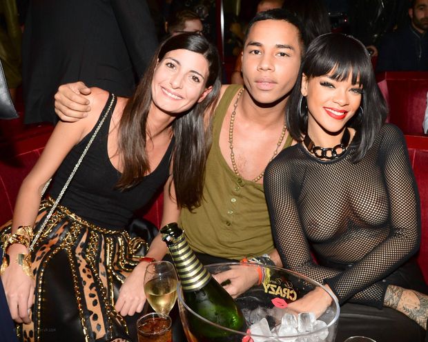 Singer Rihanna topless under see through fishnet top