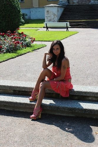 Pink princess sitting outdoor on a stairs