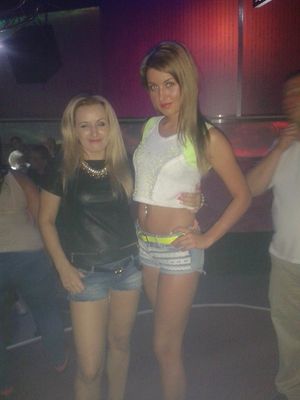 Two blonde bimbos in shorts in the club