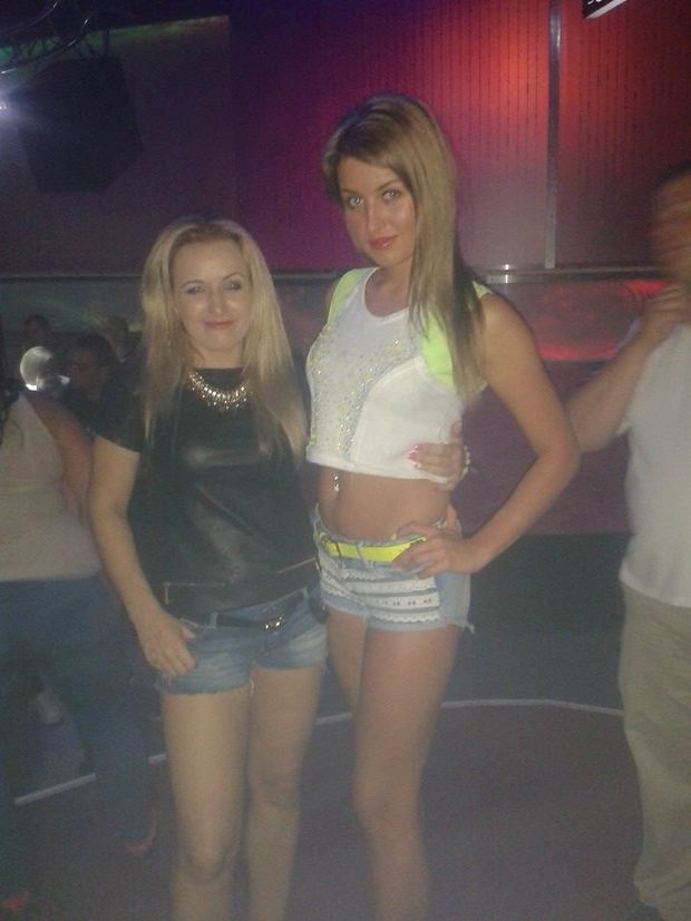Two blonde bimbos in shorts in the club