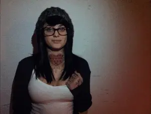 emo hipster babe with glasses flashing star tattoo boob