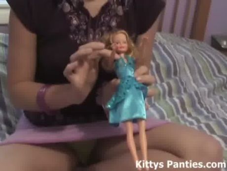 Nubile teen Kitty playing with her little dolls