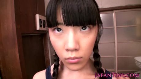 Tiny Japanese teen squirts during bukkake