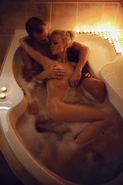 erotic couple making love in bathtub feeling the warm bodies aroma candles romantic sexual pleasure