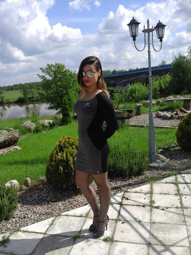 Hot babe in tight dress heels and glasses outdoor