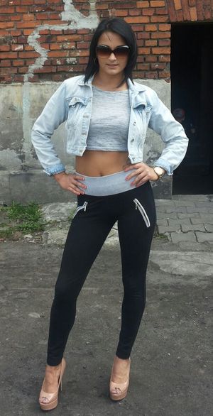 Dark hair bimbo in leggings and heels